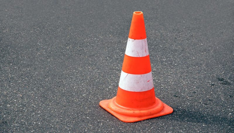 Drunk guy caught trying to bang a traffic cone at train station