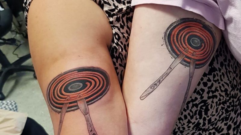 Two Hawkes Bay mates get matching tattoos of spot knives