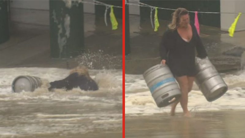 Queensland woman jumps into huge flood to rescue beer kegs