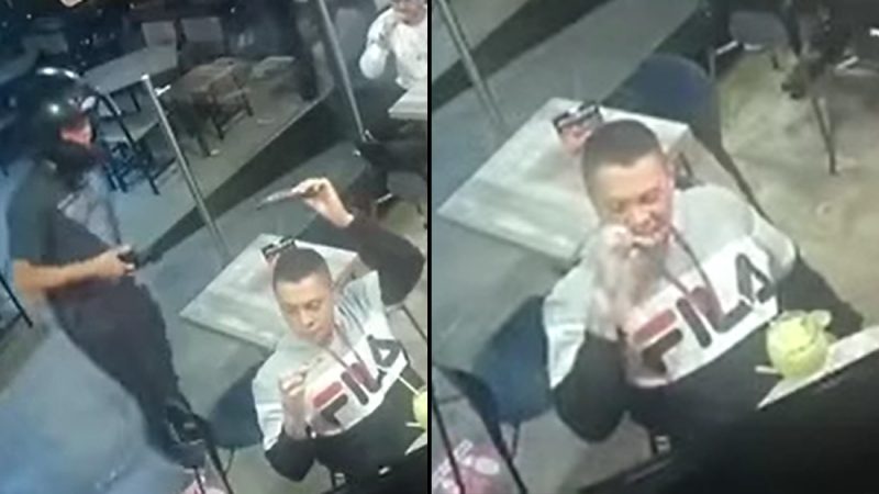 WATCH: Bloke gets robbed at gunpoint, continues eating chicken wings