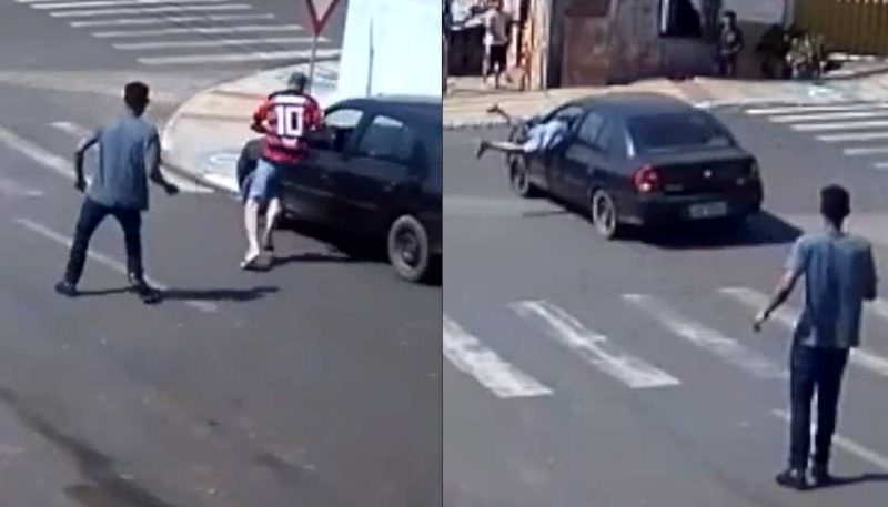 WATCH: Bloke jumps in window of moving car to stop crash