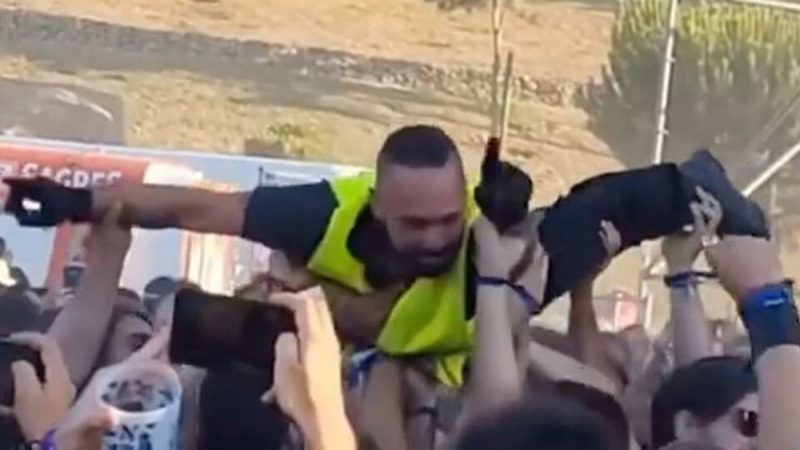 WATCH: Security guard crowd surfs at metal festival