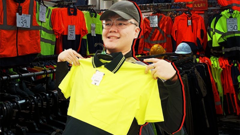 Watch this Singapore bloke become obsessed with hi-vis tradie shirts during visit to Aussie