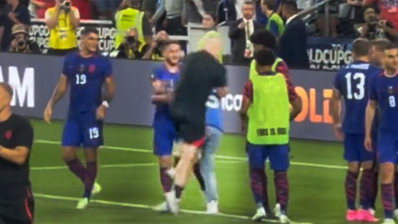 WATCH: Security guard puts massive hit on football fan who storms the field