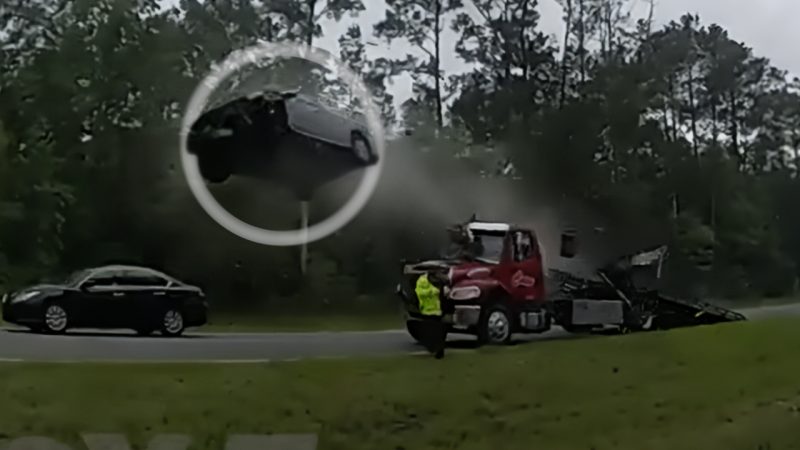 Man causes absolute scenes after driving up tow truck ramp and launching car 120ft into air