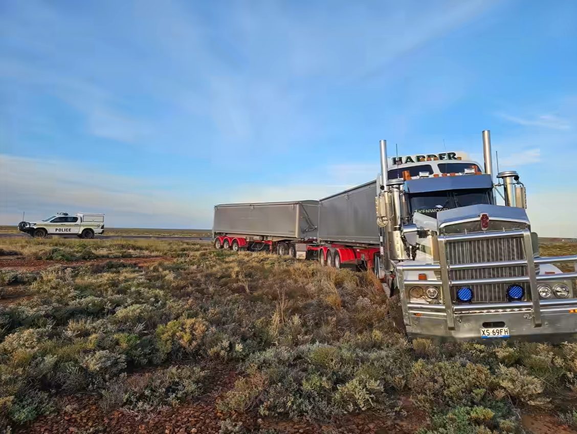 WATCH: Aussie ute barely avoids getting absolutely crushed by road train in wild dash cam vid